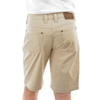 A man viewed from behind wearing stone Thomas Cook Men's Jake Comfort Waist Shorts (TCP1307031) with a white shirt partially visible at the top, photographed against a plain white studio background.
