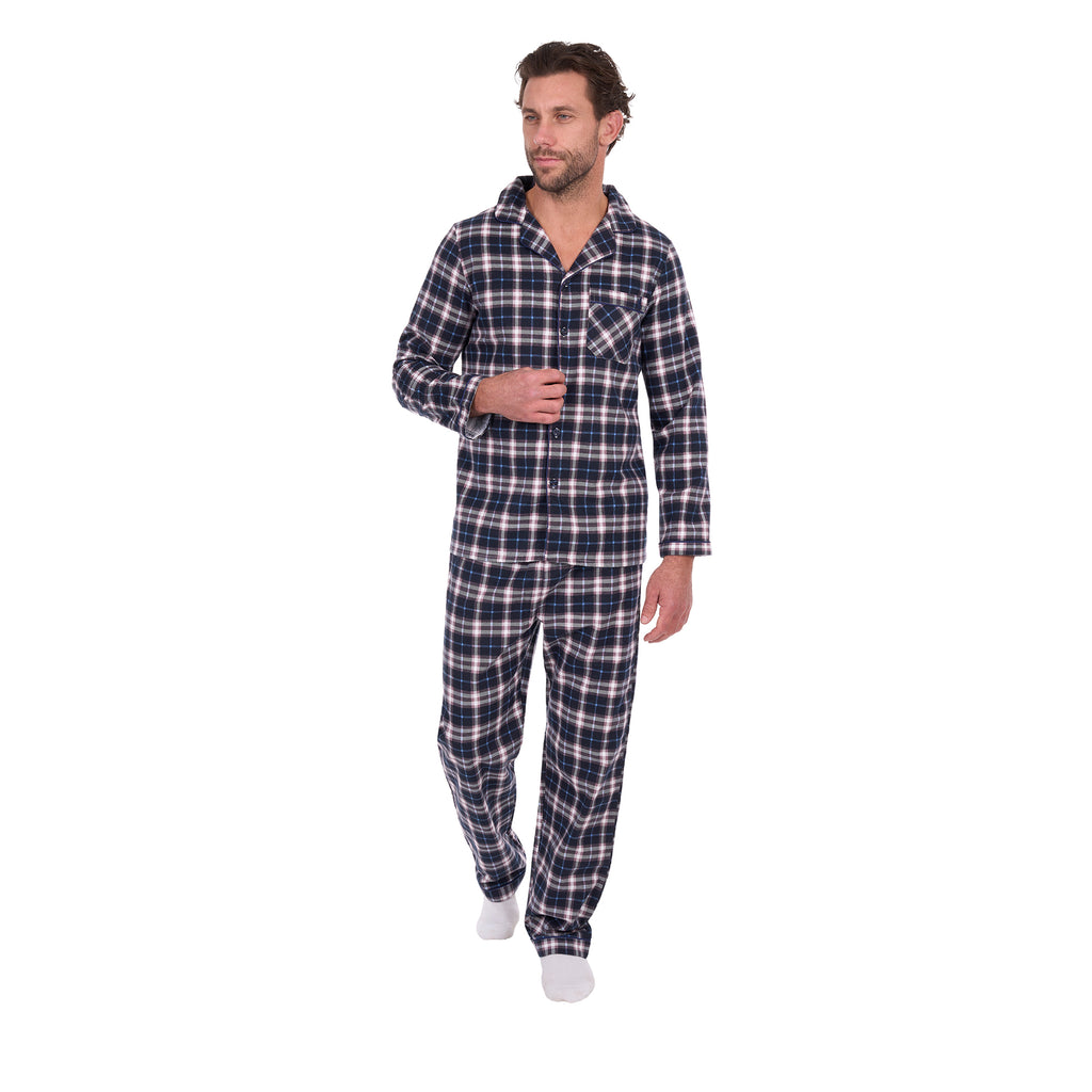 A man wearing navy blue, white, and grey plaid Thomas Cook Men's Long Sleeve Pyjamas (TCP1997PJS), standing against a solid white background.