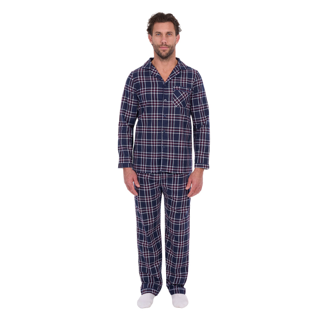 A man wearing navy blue and white plaid Thomas Cook Men's Long Sleeve Pyjamas (TCP1997PJS), standing against a solid white background.