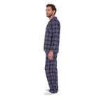 A man in profile wearing navy blue and white plaid Thomas Cook Men's Long Sleeve Pyjamas (TCP1997PJS), standing against a solid white background.