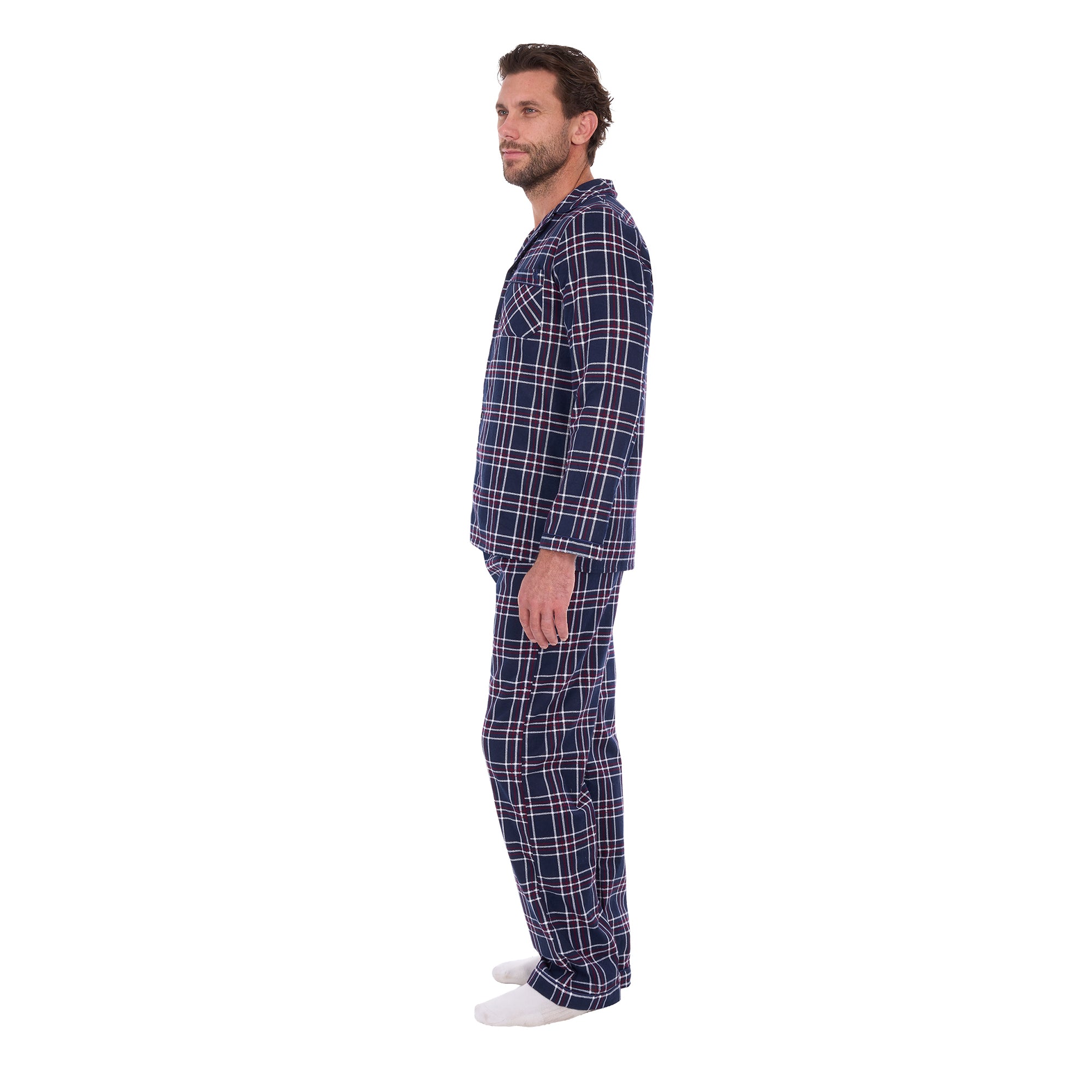 A man in profile wearing navy blue and white plaid Thomas Cook Men's Long Sleeve Pyjamas (TCP1997PJS), standing against a solid white background.