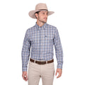 A man wearing the Thomas Cook Mens Patrick L/S Shirt (T6W1115035) Blue/Tan stands against a plain white background, paired with a light beige cowboy hat, brown belt, and beige pants, looking to his left.