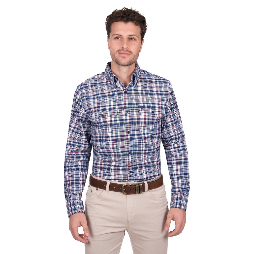 A man stands facing forward in a Thomas Cook Mens Sean L/S Shirt (T6W1115032) Blue/Red, paired with beige pants and a brown belt, against a white background.