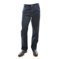 A pair of washed indigo Thomas Cook Men's Stretch Straight Leg Jeans (TCP1230381) shown from the waist down, paired with dark brown leather boots against a plain white background.