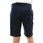 A pair of dark navy Thomas Cook Men's Tailored Fit Mossman Comfort Waist Shorts (TCP1306091) shown from behind with belt loops, jet pockets and a logo badge against a plain white background.