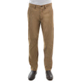 A man from the waist down wearing a pair of camel Thomas Cook Men's Tailored Fit Mossman Comfort Waist Trousers (TCP1209091) with a pair of brown boots on a white studio background.