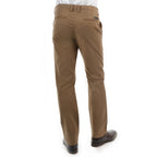 A man viewed from the back, from the waist down wearing a pair of camel Thomas Cook Men's Tailored Fit Mossman Comfort Waist Trousers (TCP1209091) with a pair of brown boots on a white studio background.