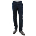 A man from the waist down wearing a pair of dark navy Thomas Cook Men's Tailored Fit Mossman Comfort Waist Trousers (TCP1209091) with a pair of brown boots on a white studio background.