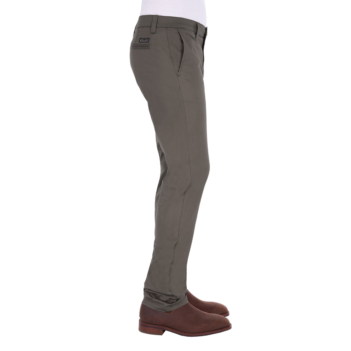 A man in profile modelling a pair of greystone Thomas Cook Men's Tailored Mossman Trousers (TCP1209091) paired with a white tee and brown boots on a white background.