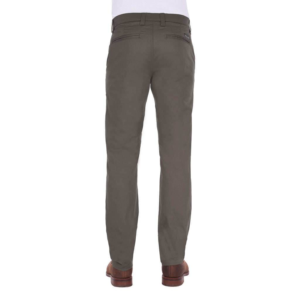 A man viewed from behind modelling a pair of greystone Thomas Cook Men's Tailored Mossman Trousers (TCP1209091) paired with a white tee and brown boots on a white background.
