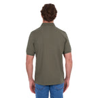 A man shown from behind modelling a military green Thomas Cook Men's Tailored Short Sleeve Polo (TCP1506009) paired with blue denim jeans on a white background.