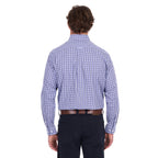 A man viewed from behind modelling a navy, blue and white Thomas Cook Men's Wentworth Long Sleeve Shirt (TCP1115158) paired with navy blue pants and a brown leather belt on a white background.