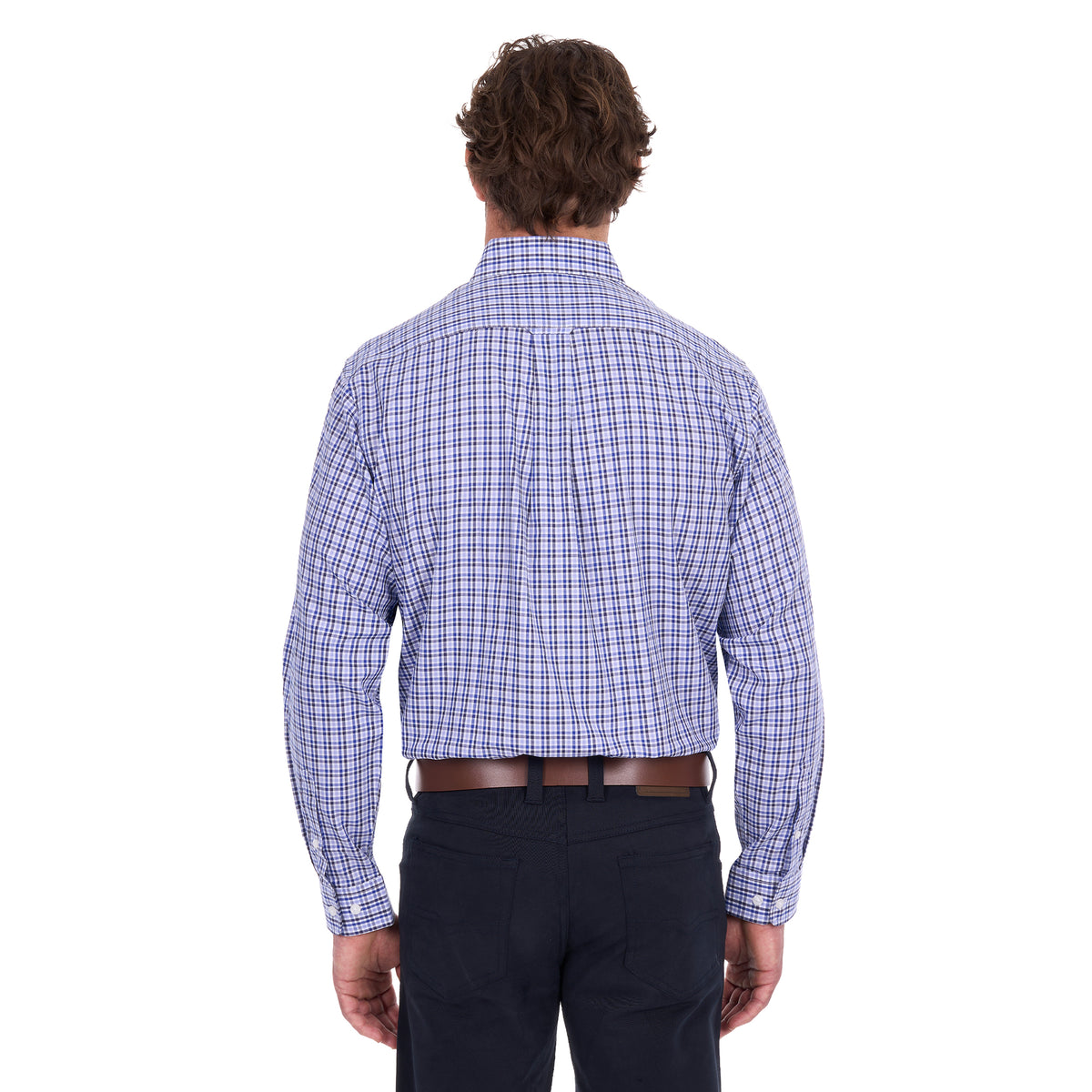 A man viewed from behind modelling a navy, blue and white Thomas Cook Men's Wentworth Long Sleeve Shirt (TCP1115158) paired with navy blue pants and a brown leather belt on a white background.
