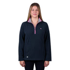 A woman modelling a navy blue Thomas Cook Women's Charlie Classic 1/4 Zip Neck Rugby (TCP2511030) with a pink zipper and a pink, white, and blue striped inner collar, shown against a plain white background.