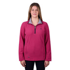 A woman modelling a deep pink Thomas Cook Women's Charlie Classic 1/4 Zip Neck Jumper (TCP2511030) with a striped inner collar, shown against a plain white background.
