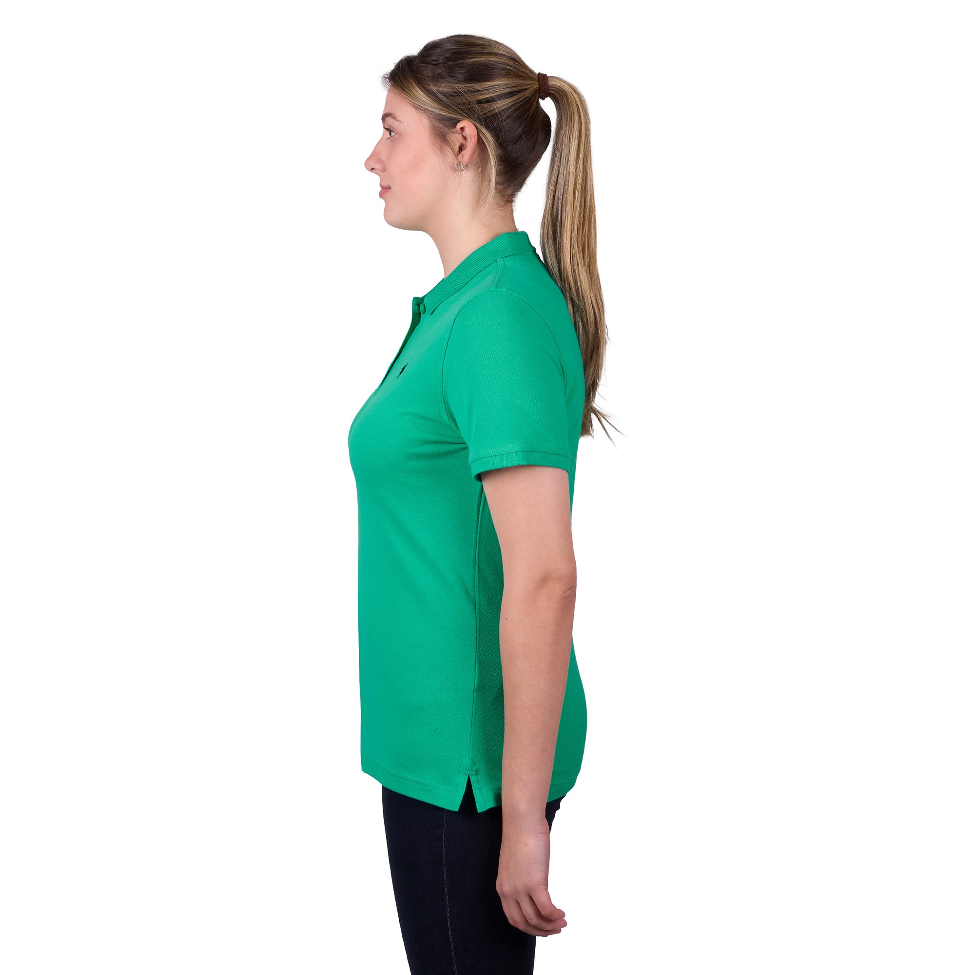 A woman in profile wearing a peppermint green Thomas Cook Women's Classic Stretch Short Sleeve Polo with a Thomas Cook embroidered logo on a white background.