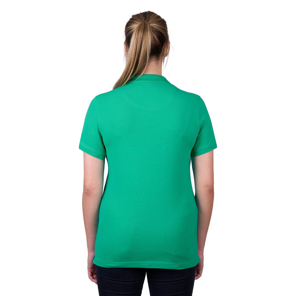 A woman viewed from behind wearing a peppermint green Thomas Cook Women's Classic Stretch Short Sleeve Polo on a white background.