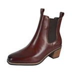 The Thomas Cook Womens Drayton Boots (TCP28509) in Brunette Brown feature full grain leather, a square toe, elastic side panels, pull tabs, and a low stacked heel, shown on a white background.