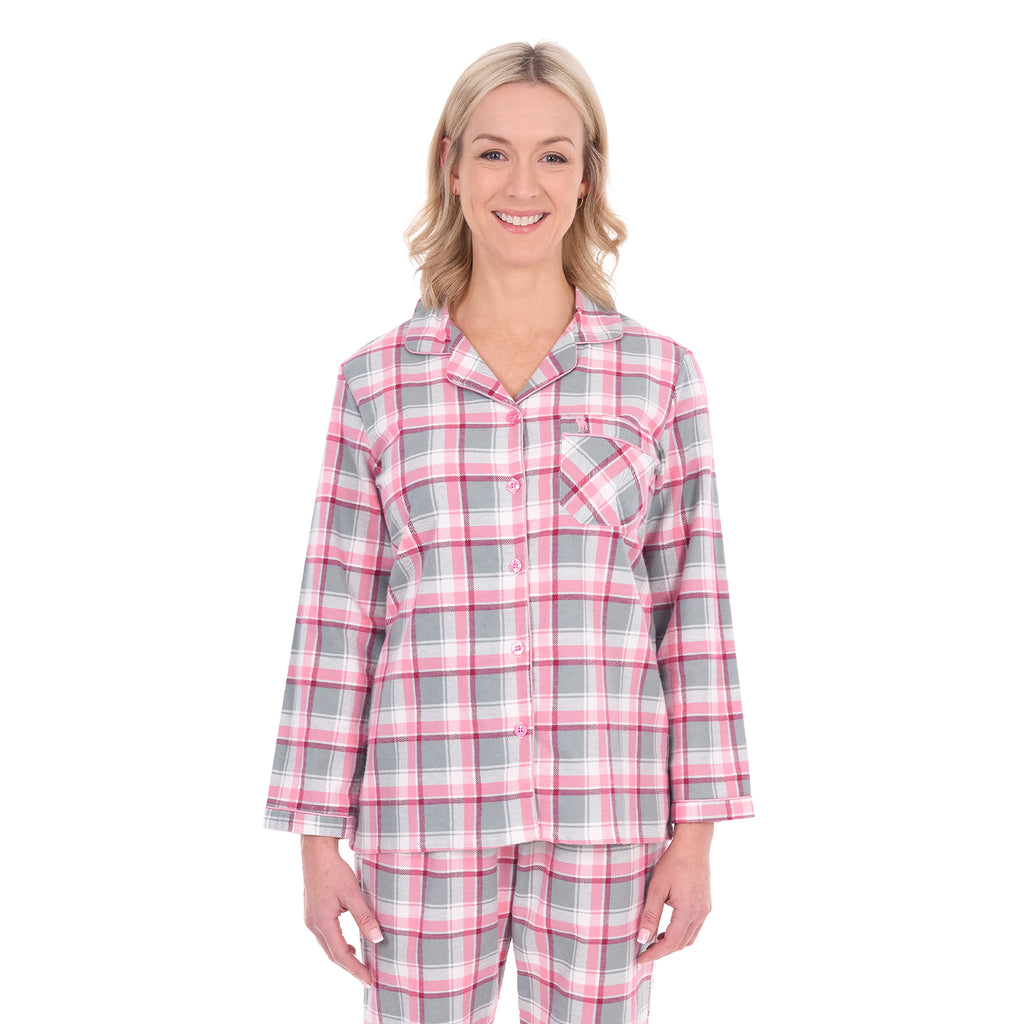 A woman modelling pink, grey, and white plaid Thomas Cook Women's Long Sleeve Pyjamas (TCP2982PJS) against a plain white background.