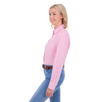 A woman in profile modelling a Thomas Cook Women's Lawson Long Sleeve Shirt (TCP2112178) with blue jeans and a brown belt, shot against a solid white background.