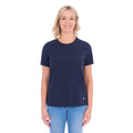 A woman modelling a navy blue Thomas Cook Women's Round Neck Short Sleeve Tee (TCP2515104) paired with blue denim jeans on a white background.