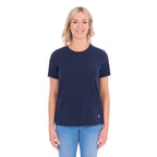 A woman modelling a navy blue Thomas Cook Women's Round Neck Short Sleeve Tee (TCP2515104) paired with blue denim jeans on a white background.