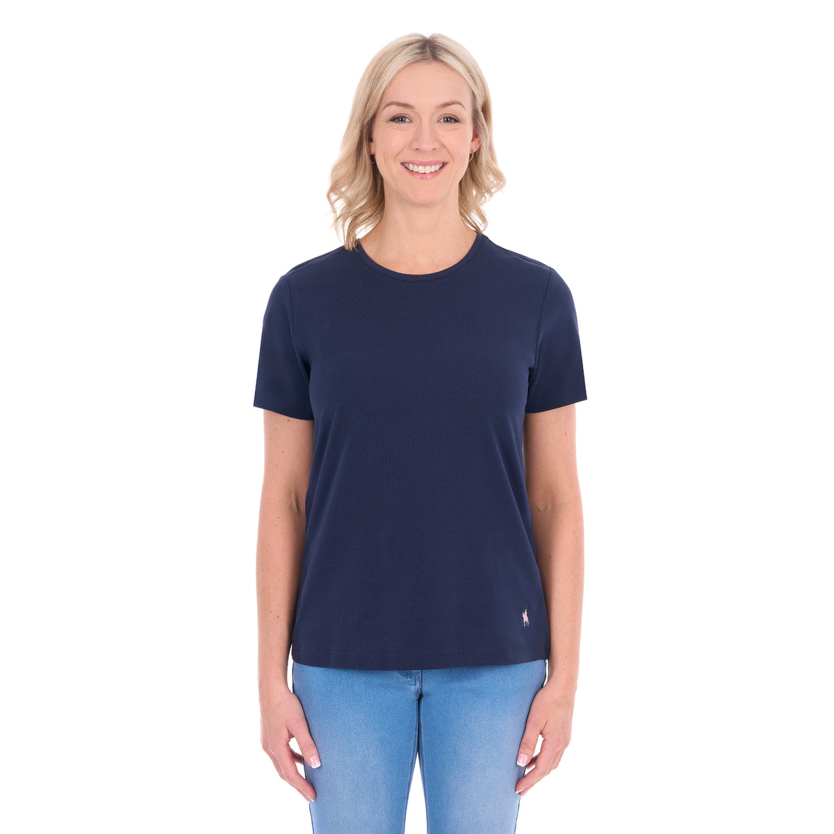 A woman modelling a navy blue Thomas Cook Women's Round Neck Short Sleeve Tee (TCP2515104) paired with blue denim jeans on a white background.