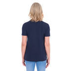 A woman shown from behind modelling a navy blue Thomas Cook Women's Round Neck Short Sleeve Tee (TCP2515104) paired with blue denim jeans on a white background.