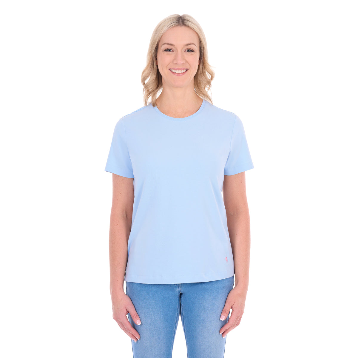 A woman modelling a pale blue Thomas Cook Women's Round Neck Short Sleeve Tee (TCP2515104) paired with blue denim jeans on a white background.