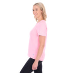 A woman in profile modelling a rose pink Thomas Cook Women's Round Neck Short Sleeve Tee (TCP2515104) paired with blue denim jeans on a white background.