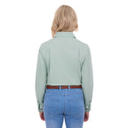 A woman from behind modelling a mint green Thomas Cook Women's Stretch Drill Half Button Long Sleeve Work Shirt (TCP2100106), paired with blue jeans and a brown woven belt, against a plain white background.
