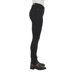 Black Thomas Cook Women's Suzie Slimmer Leg Wonder Jeans 32 Leg (TCP2215128) shown from the side on a model from the waist down, paired with brown leather boots against a plain white background.