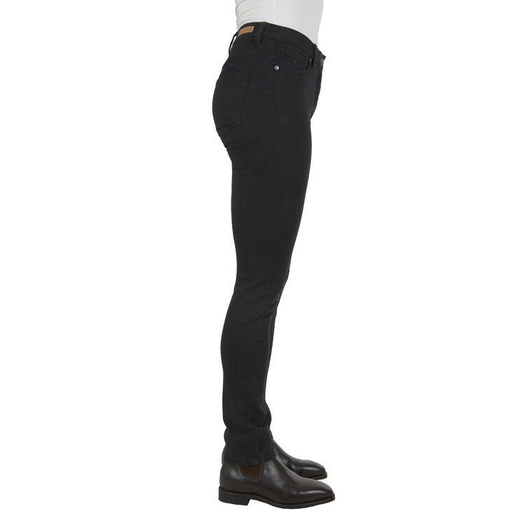 Black Thomas Cook Women's Suzie Slimmer Leg Wonder Jeans 32 Leg (TCP2215128) shown from the side on a model from the waist down, paired with brown leather boots against a plain white background.