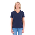 A woman with blonde hair wearing a navy blue Thomas Cook Women's V Neck Short Sleeve Tee (TCP2550105) and denim jeans, standing against a plain white background.