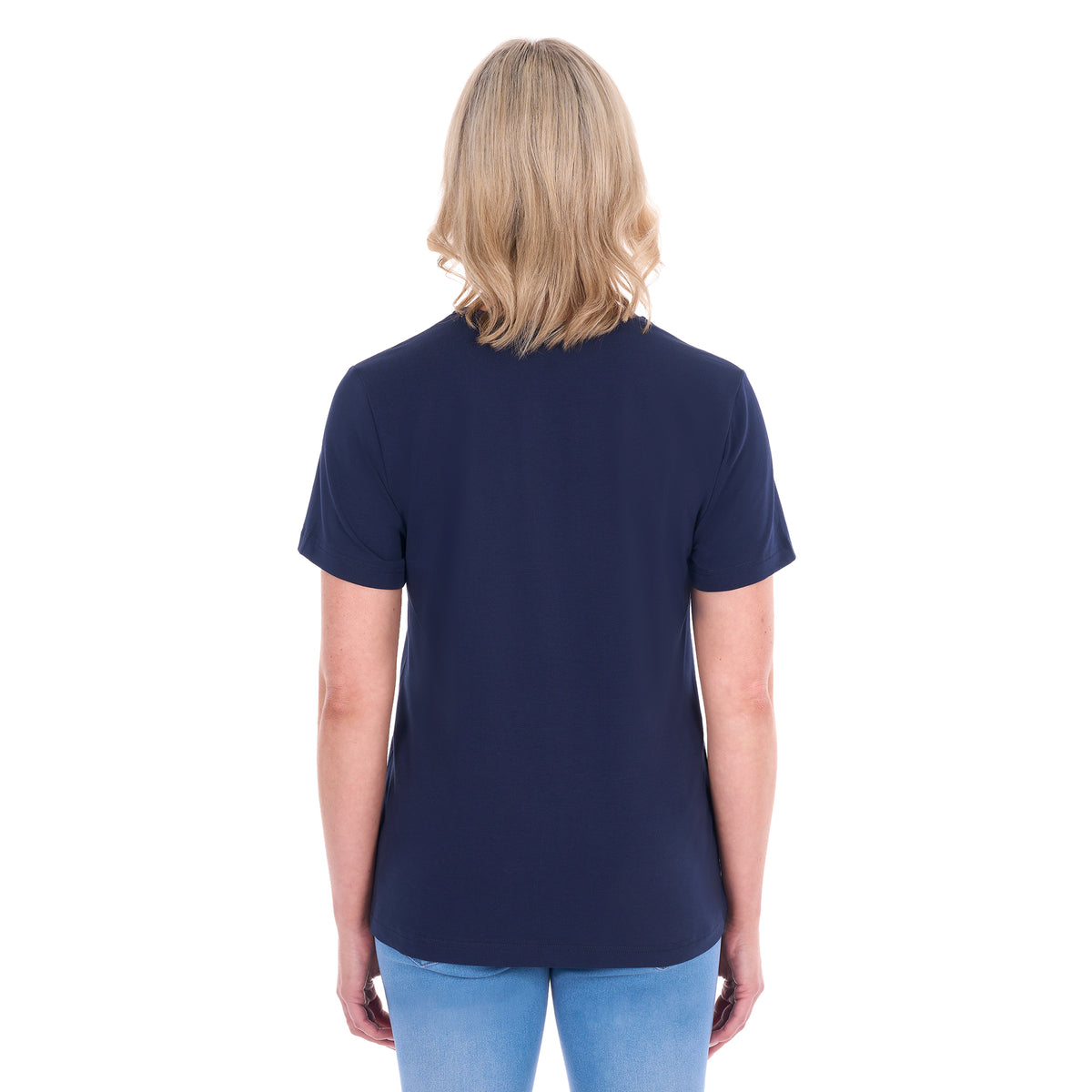 A woman viewed from behind with blonde hair wearing a navy blue Thomas Cook Women's V Neck Short Sleeve Tee (TCP2550105) and denim jeans, standing against a plain white background.