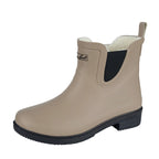 The Thomas Cook Womens Wynyard Gumboots (T6W28503) in ecru feature a tan rubber design, black elastic side panels and sole, slight heel, back pull tab, and soft faux fur lining for comfort.