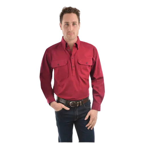 Man wearing a red Thomas Cook Heavy Drill 1/2 Button Long Sleeve Shirt (TCP1120163) and dark jeans on a white background.