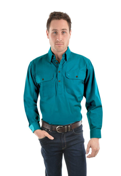 Man wearing a teal Thomas Cook Heavy Drill 1/2 Button L/S Shirt (TCP1120163) and dark jeans on a white background