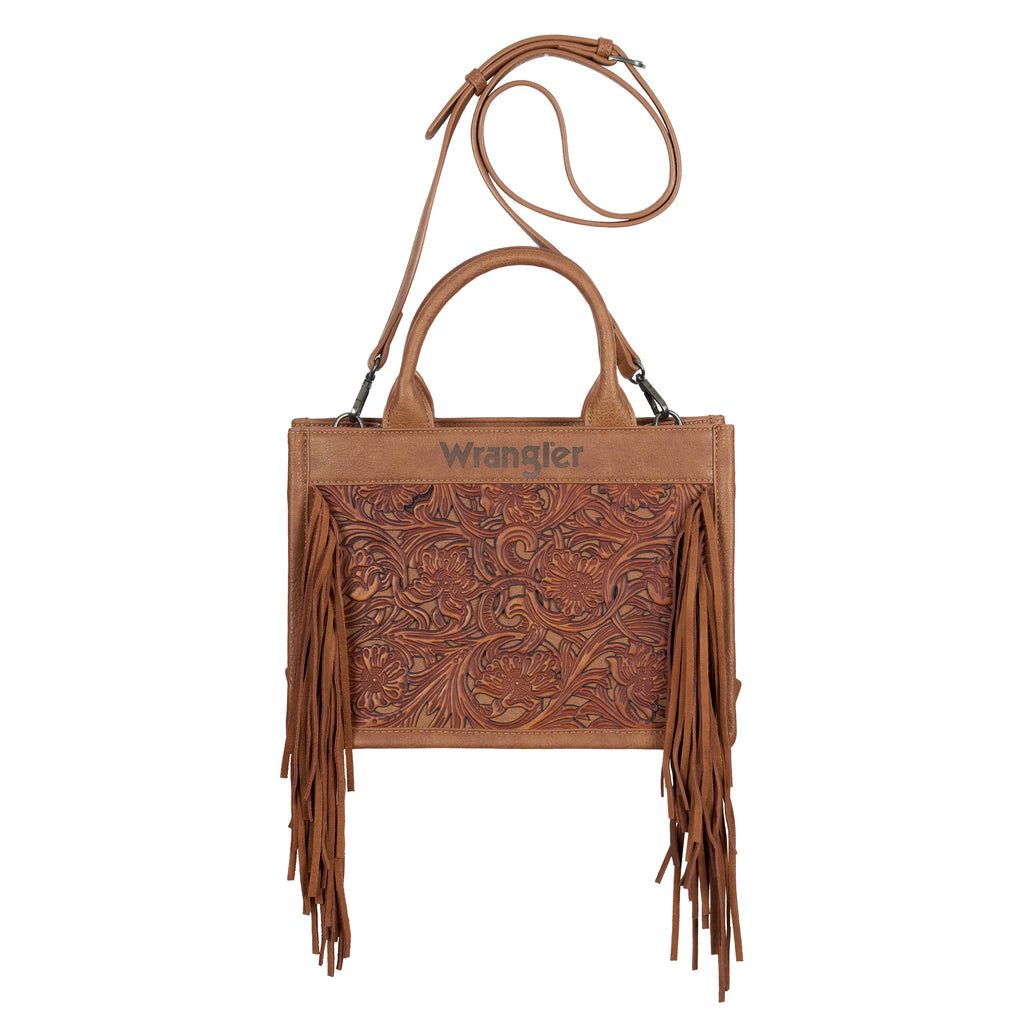 A tan Wrangler Adelyn Bag (X6S2975BAG) with tooled leather insert, fringe, dual top handles, and a long shoulder strap, featuring the Wrangler logo on the front.