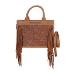 A tan Wrangler Adelyn Bag (X6S2975BAG) with tooled leather insert, long fringe, dual top handles, and a matching shoulder strap, shown on a plain white background. The Wrangler brand name is printed on the front.