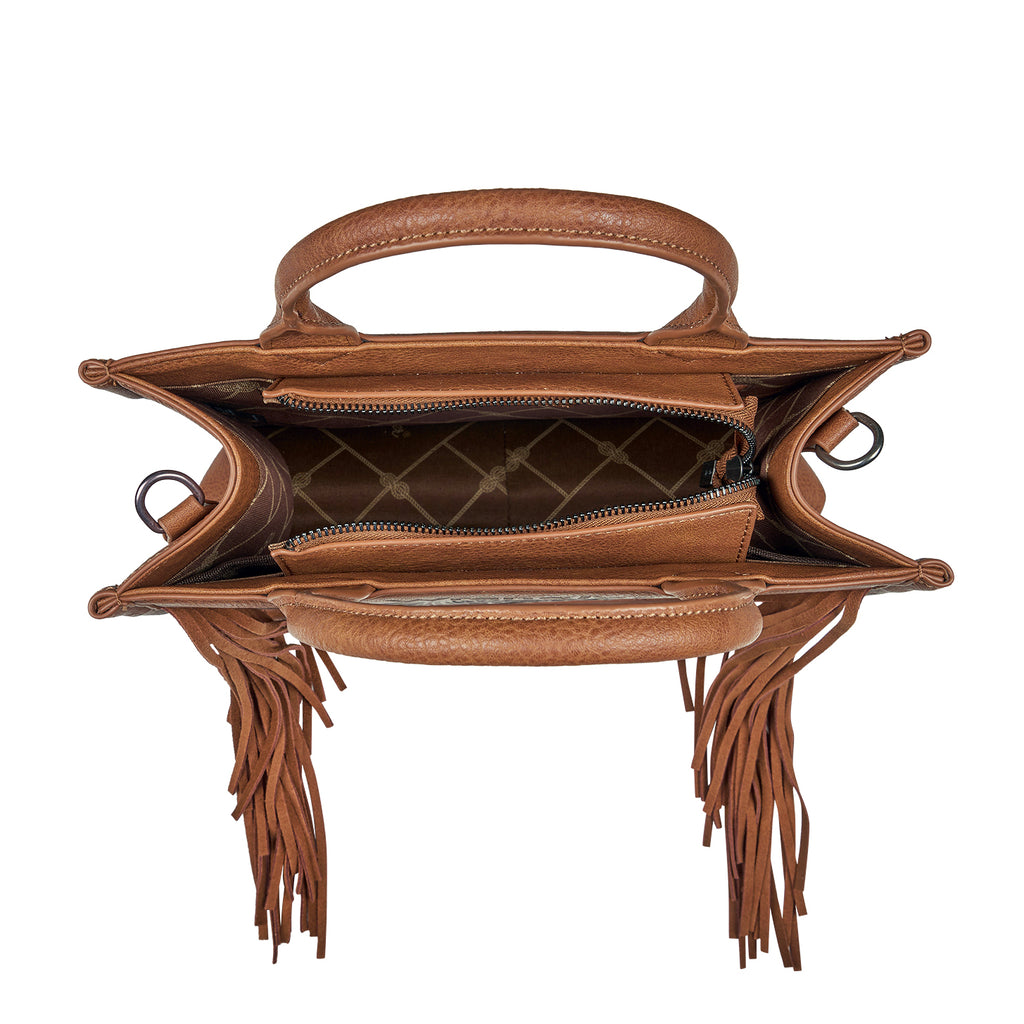 A tan Wrangler Adelyn Bag (X6S2975BAG) shown open from the top, featuring top handles, fringe details hanging from the sides, and a patterned interior lining.