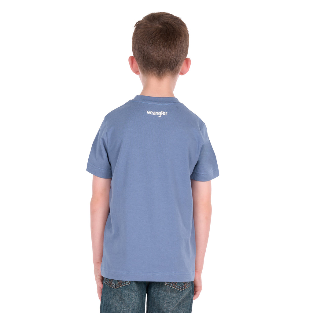 A young boy photographed from behind wearing a storm blue Wrangler Boys Michael Short Sleeve Tee (X6S3557684) paired with blue jeans, standing against a solid white background.