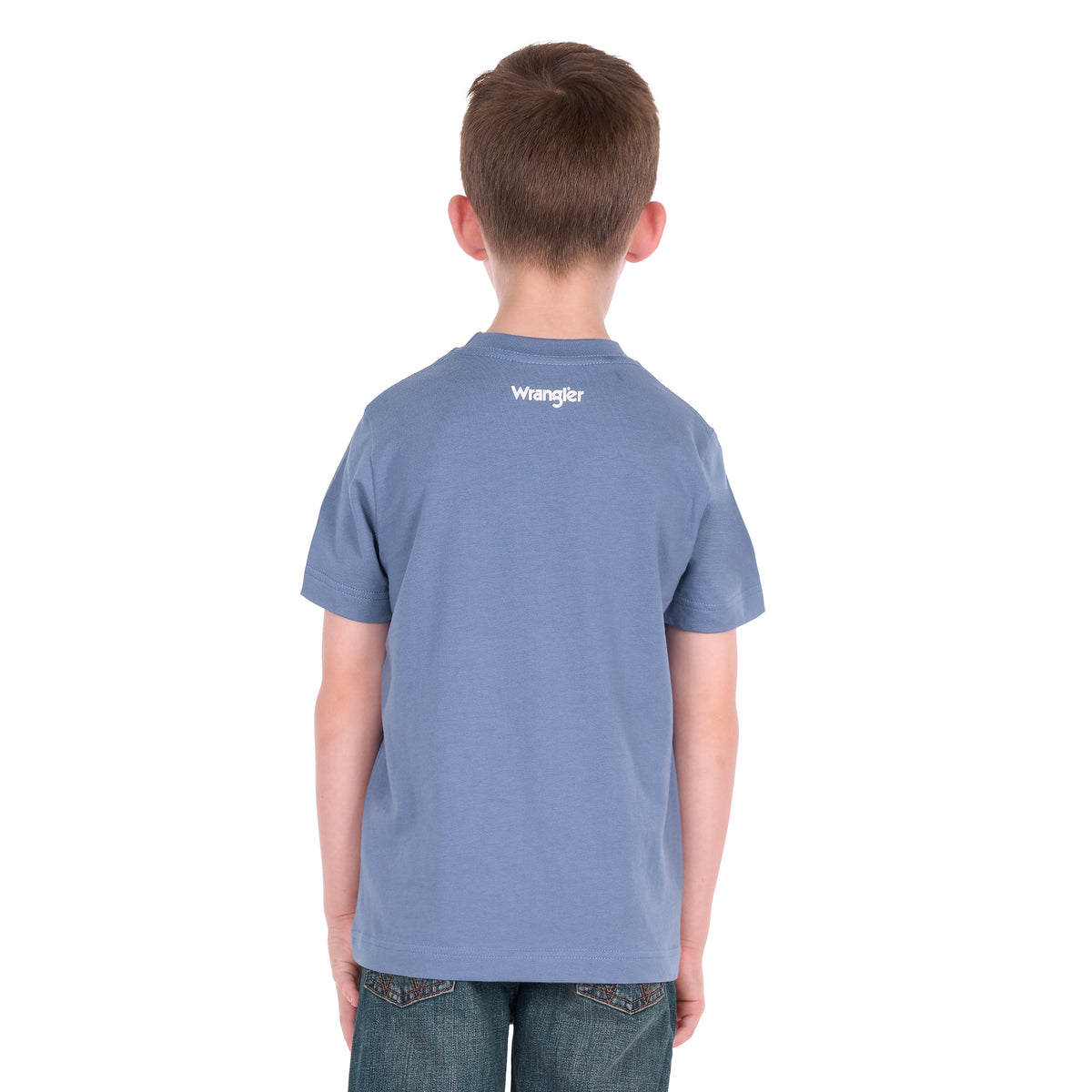 A young boy photographed from behind wearing a storm blue Wrangler Boys Michael Short Sleeve Tee (X6S3557684) paired with blue jeans, standing against a solid white background.