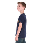 A young boy side on to the camera wearing a Wrangler Boys Robert Short Sleeved Tee (X6S3557687) in Navy with a pair of denim jeans.
