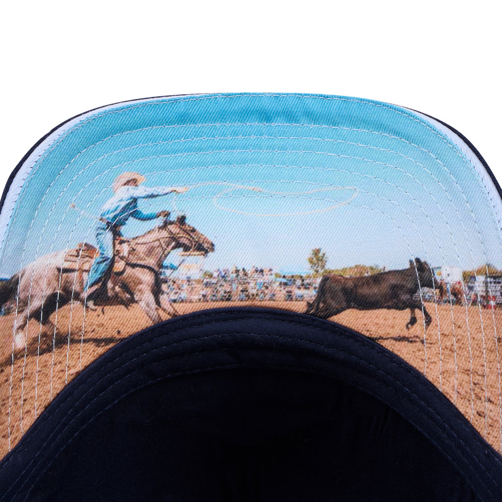 Wrangler Hank High Profile Trucker Cap (X6S1943CAP) Navy/Light Blue under peak detail.