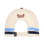 An cream and copper Wrangler Imogen High Profile Full Back Cap (X6S2946CAP) shown from the back, featuring a copper embroidered 'W', light blue and navy blue stripes, and a small black Wrangler logo pip on the adjustable snap back closure.