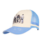 A light blue and cream Wrangler Josie High Profile Trucker Cap (X6S2943CAP) featuring a western-themed graphic print on the front panel and cream embroidered text on the brim.