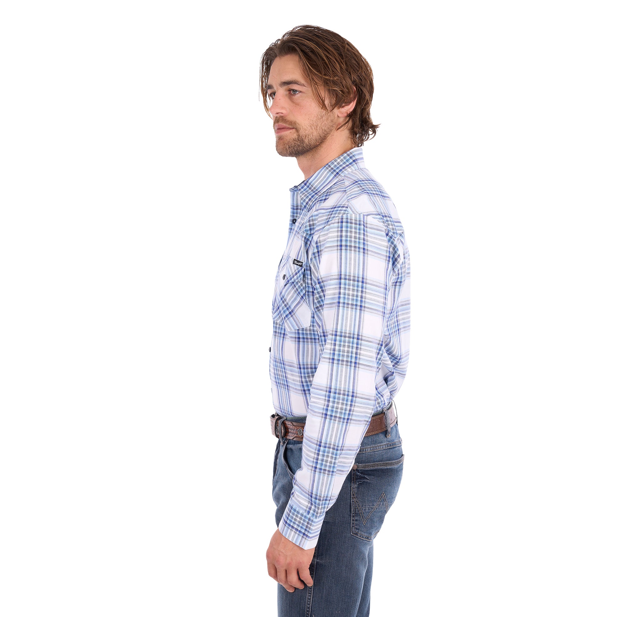 A man in profile wearing a light blue, royal blue and white Wrangler Men's Eric long-sleeve western-style plaid button-down Shirt (X6S1111667) paired with dark blue jeans, set against a plain white background.