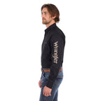 A man in profile wearing a black Wrangler Men's Flex Logo Long Sleeve Shirt (XCP1155359) with a light tan Wrangler Onyx Belt (X6S1969BLT) and blue jeans, standing against a solid white background.