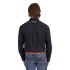 A man from behind wearing a black Wrangler Men's Flex Logo Long Sleeve Shirt (XCP1155359) with a light tan Wrangler Onyx Belt (X6S1969BLT) and blue jeans, standing against a solid white background.
